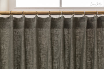 Linen curtain with pleating tape and crown in Safari greenLinen Couture